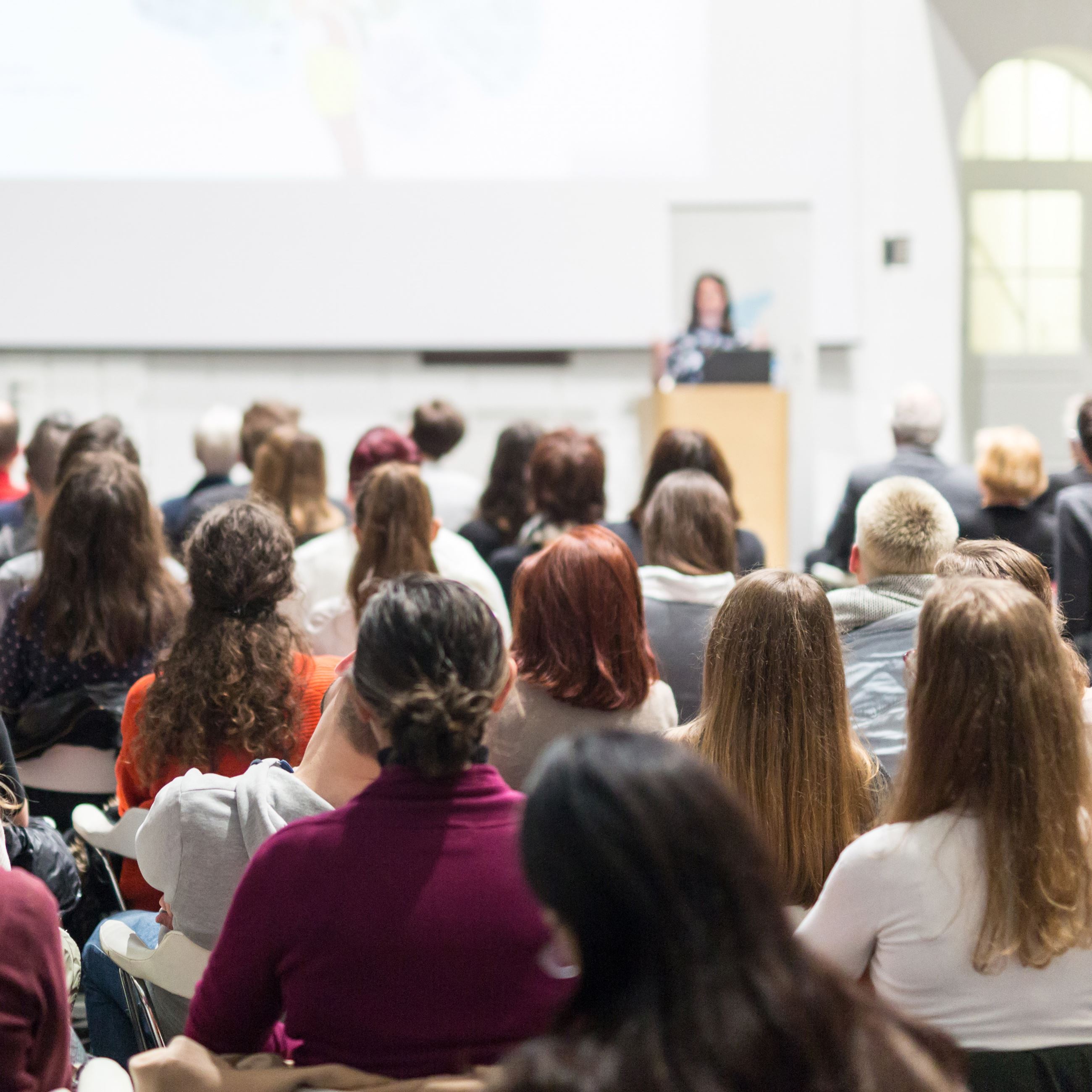 Attendees hear speaker at conference