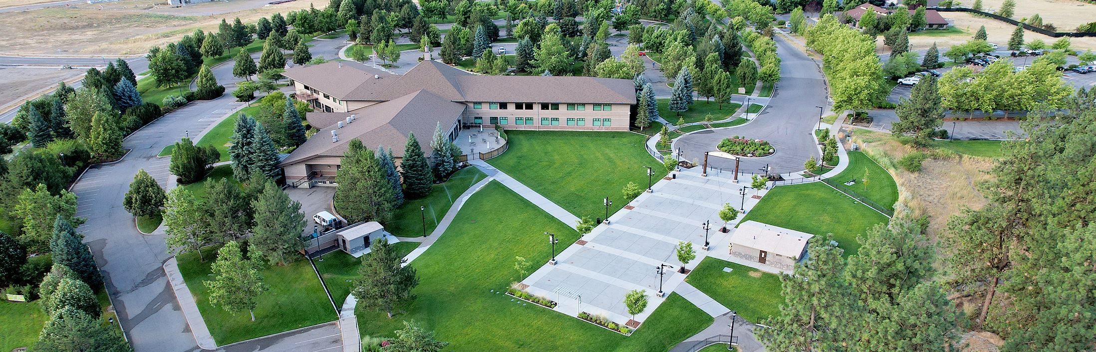 Aerial image of building and adjacent lawn for events.